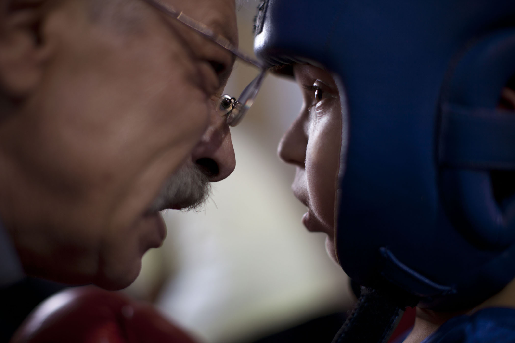 An Israeli coach talks to a young boxer before his fight during Israel's National Youth Boxing Championship in the Arab village of Kfar Yasif, northern Israel.