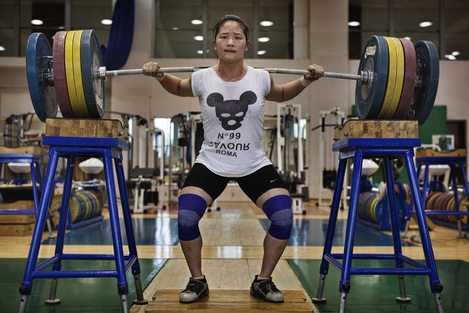 Zhou Wenyu, from Hunan province, trains at the national sports training center in Beijing for a place on the Chinese women's Olympic weight-lifting team.