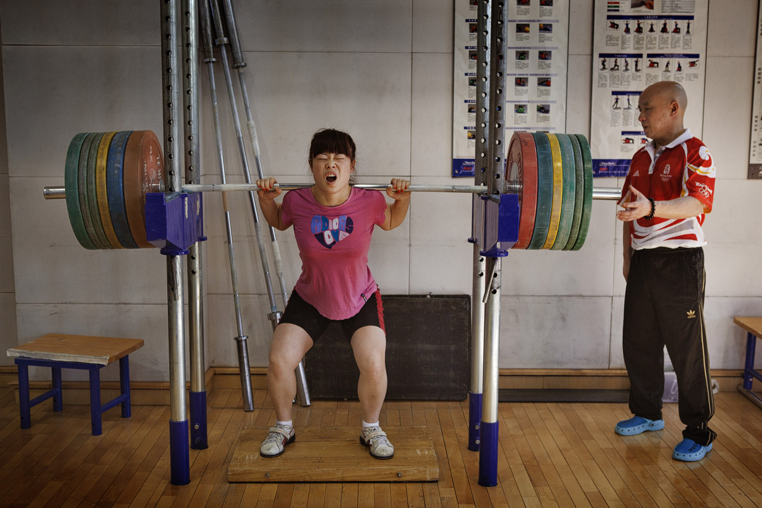 Wang Mingjuan tries out for the Chinese women's Olympic weight-lifting team at the national sports training center in Beijing. Weighing just 48 kg (106 lb.), Mingjuan nonetheless qualified for the team and is competing in the London Olympics.