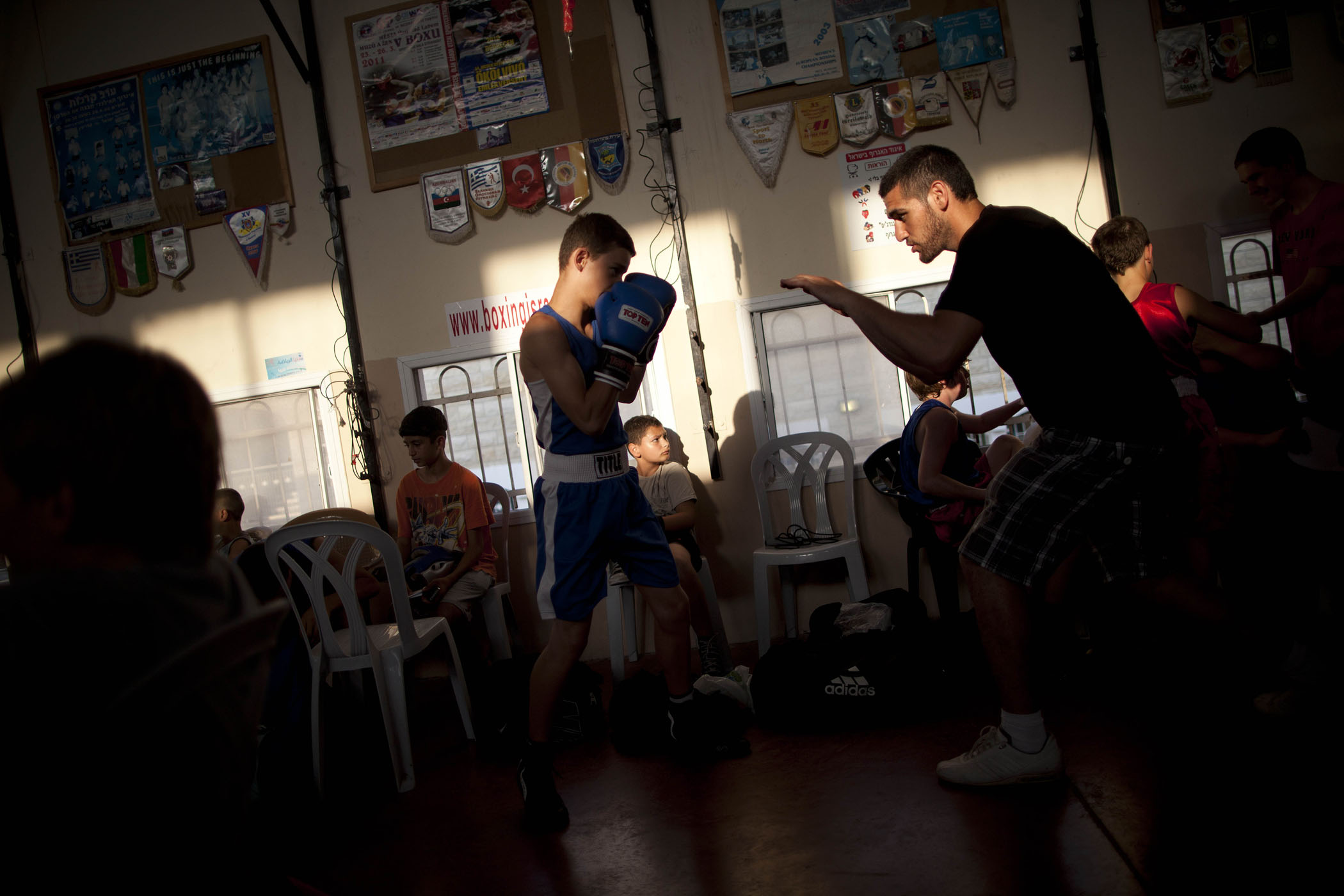 Israeli boys warm up before a fight during Israel's National Youth Boxing Championship in the Arab village of Kfar Yasif, northern Israel.