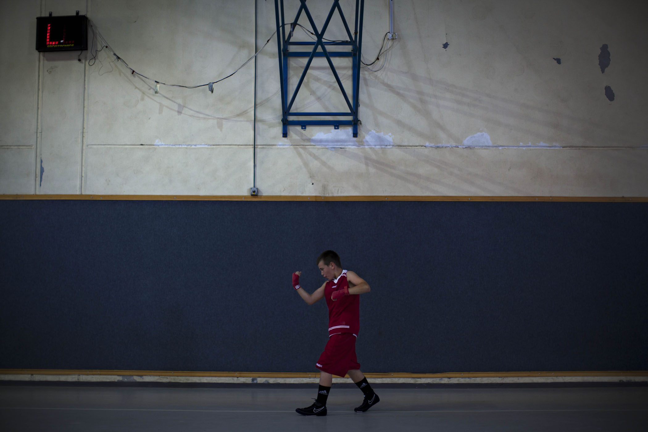 An Israeli boy warms up before a fight during Israel's National Youth Boxing Championship in the Arab village of Arabe, northern Israel.