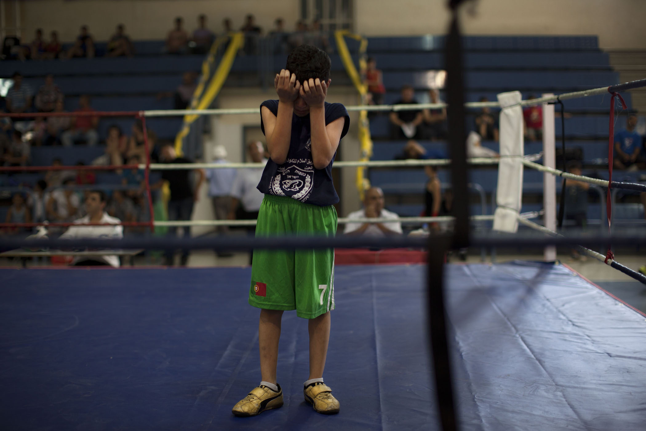 A young Israeli Arab boxer cries after losing a fight during Israel's National Youth Boxing Championship in the Arab village of Arabe, northern Israel.