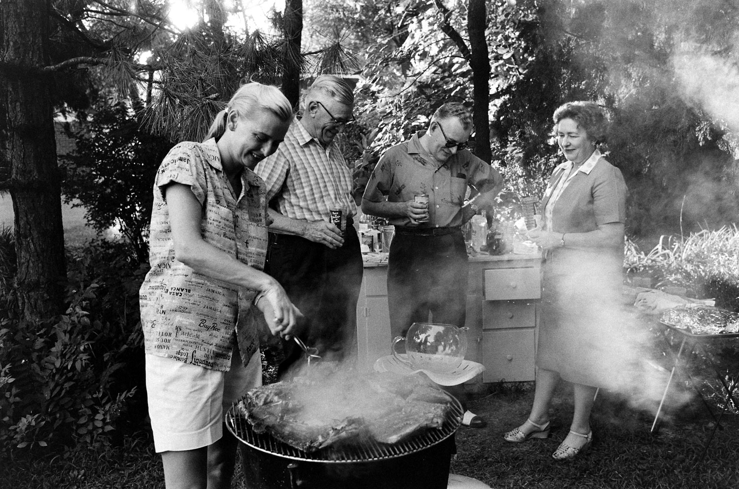 One of only thirteen American women — known as the Mercury 13 — to participate in NASA's Mercury space program, Jerrie Cobb (left) barbecues in 1959.