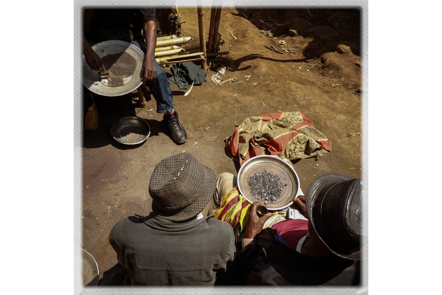 The first stage of coltan refining after being brought out of the mine, in Numbi.