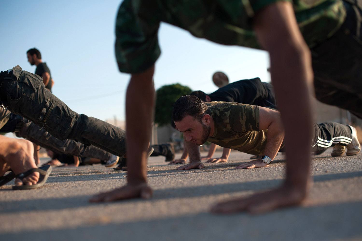 Aug. 18, 2012.Volunteers with the Ibn Walid katiba (brigade) take part in physical training on the outskirts of Marea in northern Syria.