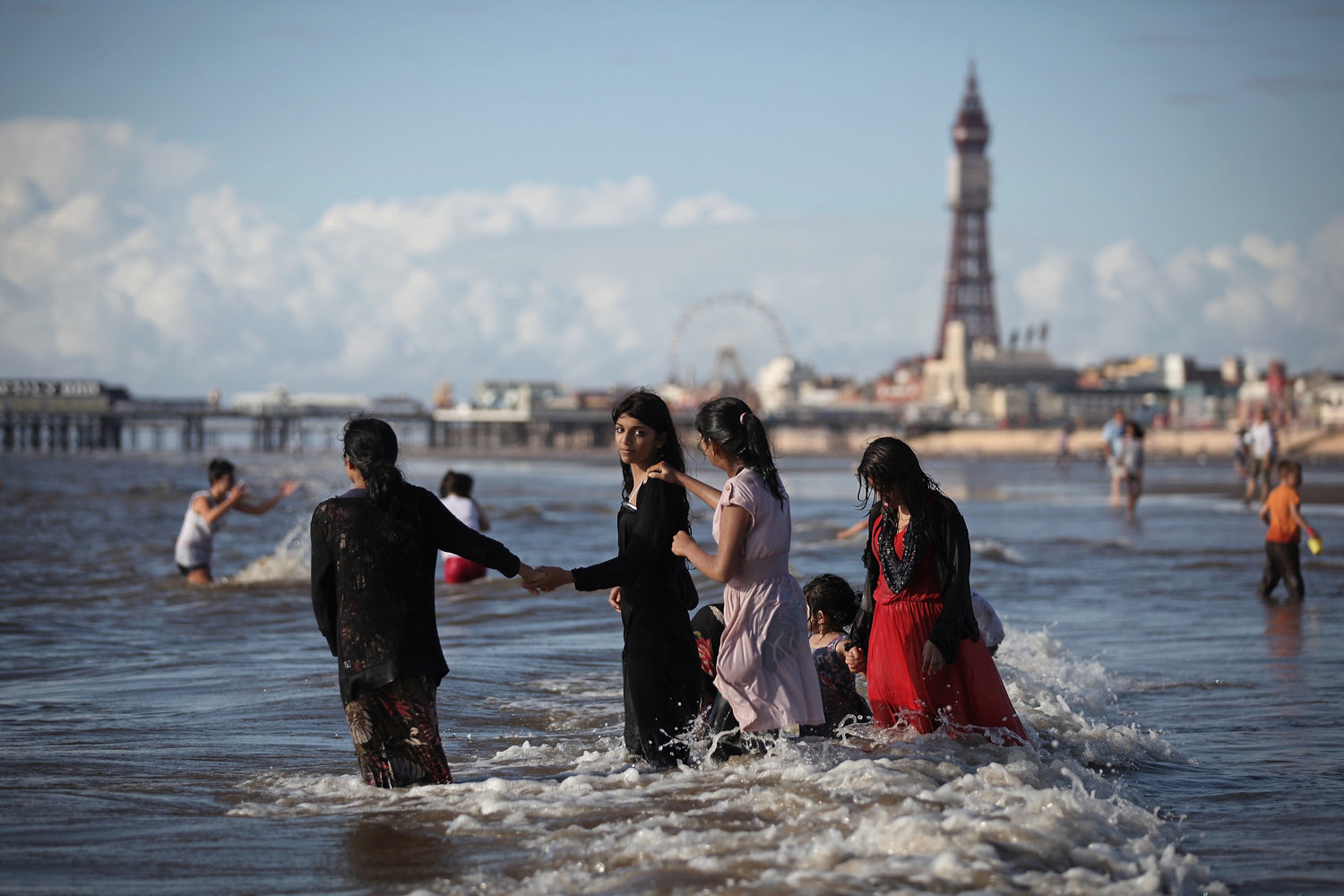 Aug. 21, 2012. A family plays in the sea in Blackpool, England.