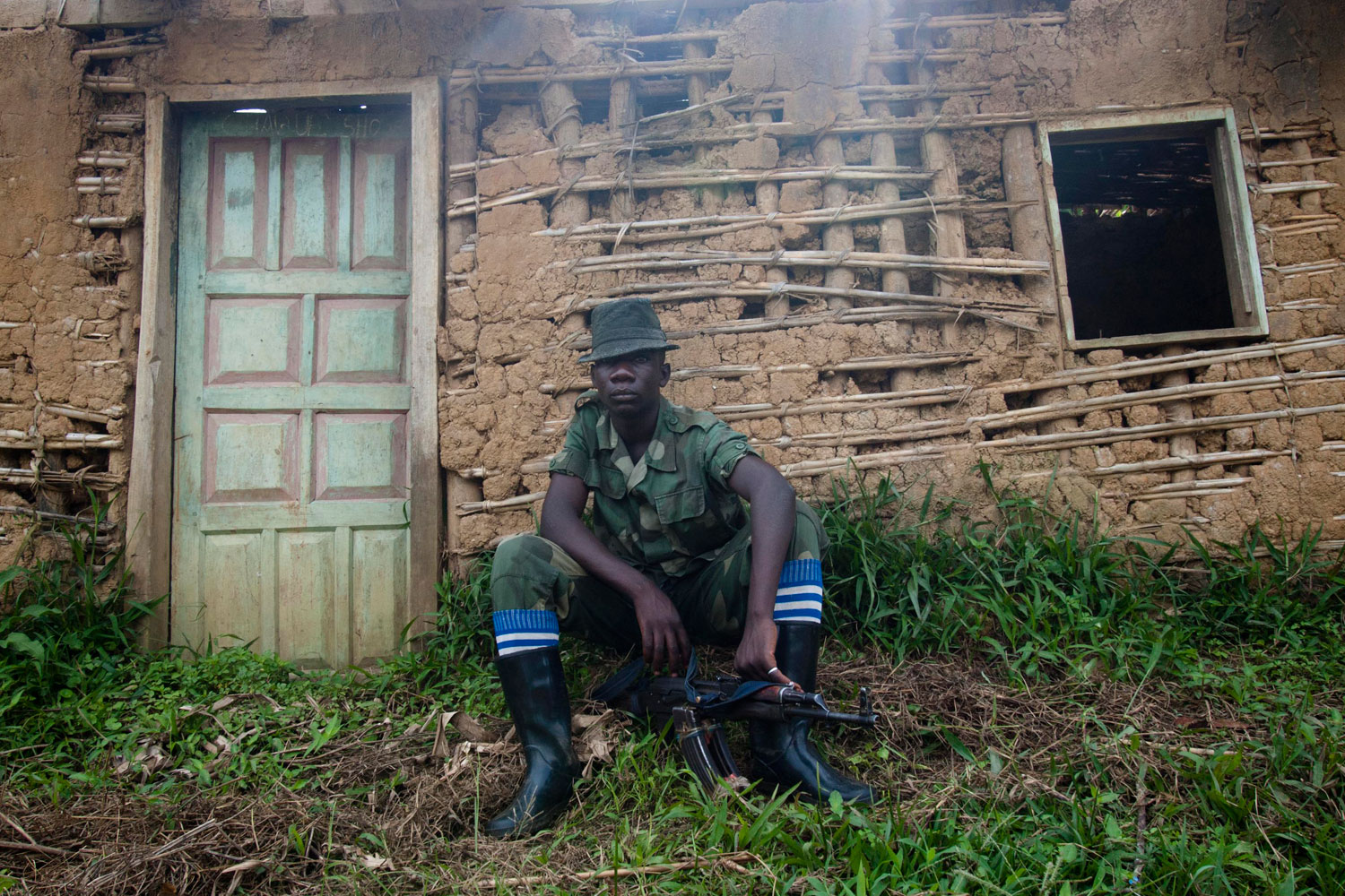 Aug. 22, 2012. An Alliance Patriot For Congo Libre and Sovereign (APCLS) mayi-mayi rebel waits where they have their headquarters in Luckweti village, north Kivu, Democratic Republic of the Congo.