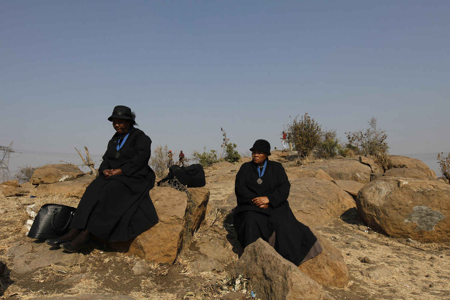 Aug. 23, 2012. Members from a local church mourn near the site where miners were killed during clashes at Lonmin's Marikana platinum mine, before a memorial service in Rustenburg, 100 km (62 miles) northwest of Johannesburg,