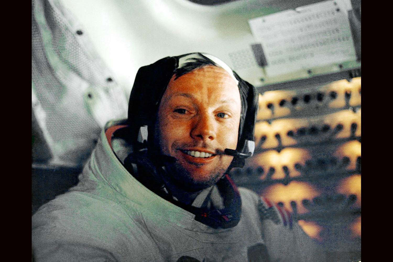 A tired but quietly jubilant Apollo 11 astronaut Neil Armstrong in space capsule after his historic walk on moon, July 1969.