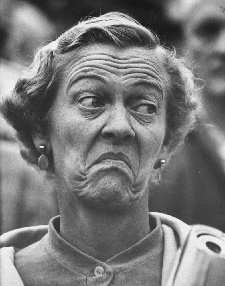 Mrs. Leland S. McCleery watches her Michigan Wolverines lose to the Wisconsin Badgers, 1959.