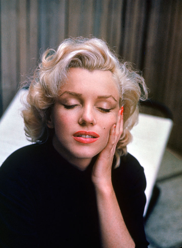 A serene Marilyn Monroe on the patio outside of her Los Angeles home, 1953.