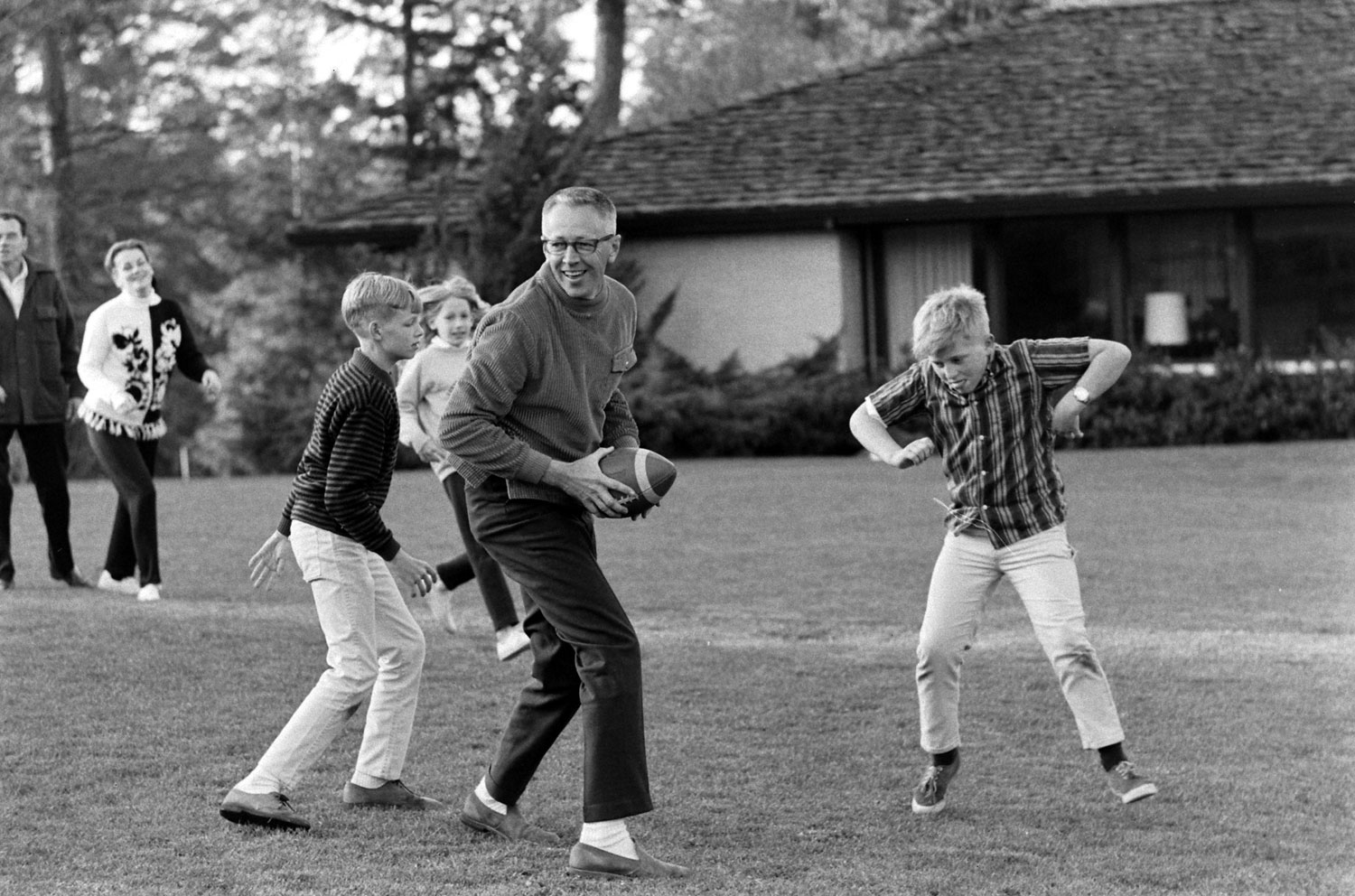 Charles Schulz plays football at his home in California in 1967.