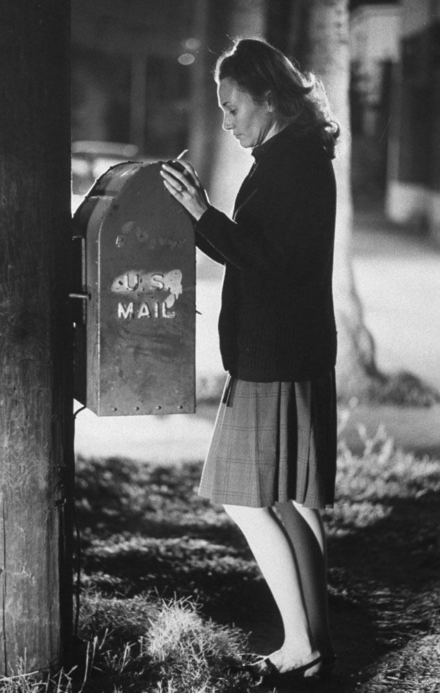 Mrs. Arthur Mearns mails her weekly letter to her missing husband, an Air Force Major, who has not been heard from for three years, Los Angeles, 1969.