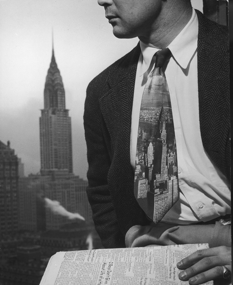 Skyline tie was made from picture of New York's Chrysler building, visible beyond wearer's shoulder.