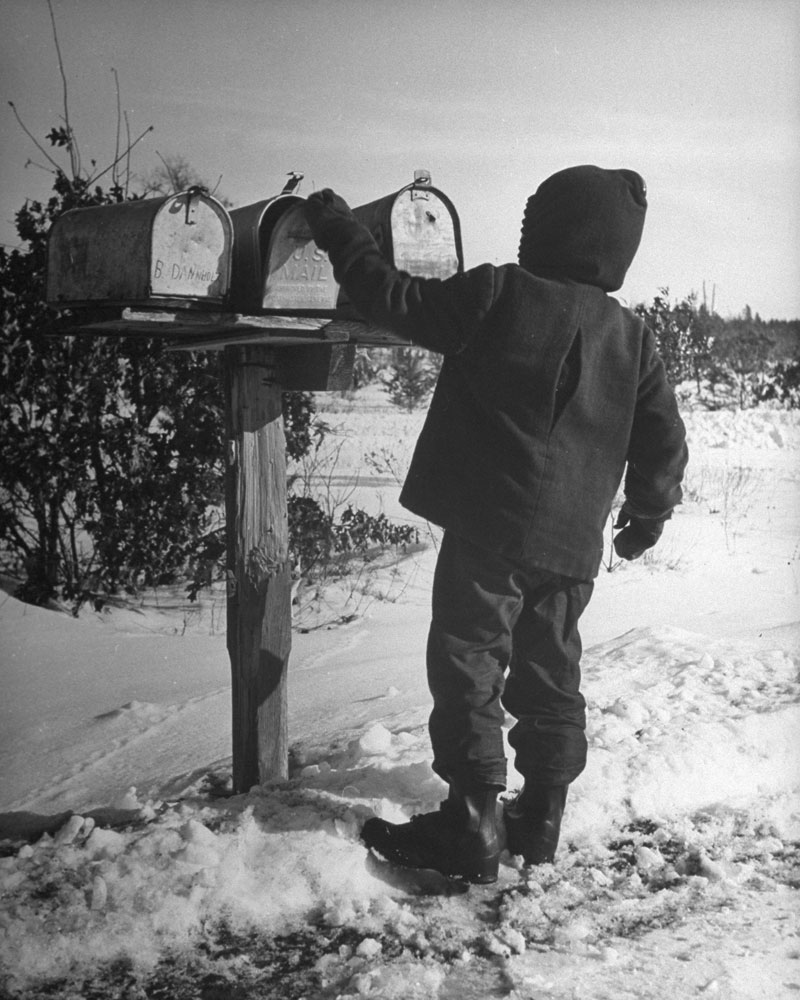 Opening the family mailbox, Wisconsin, 1946.