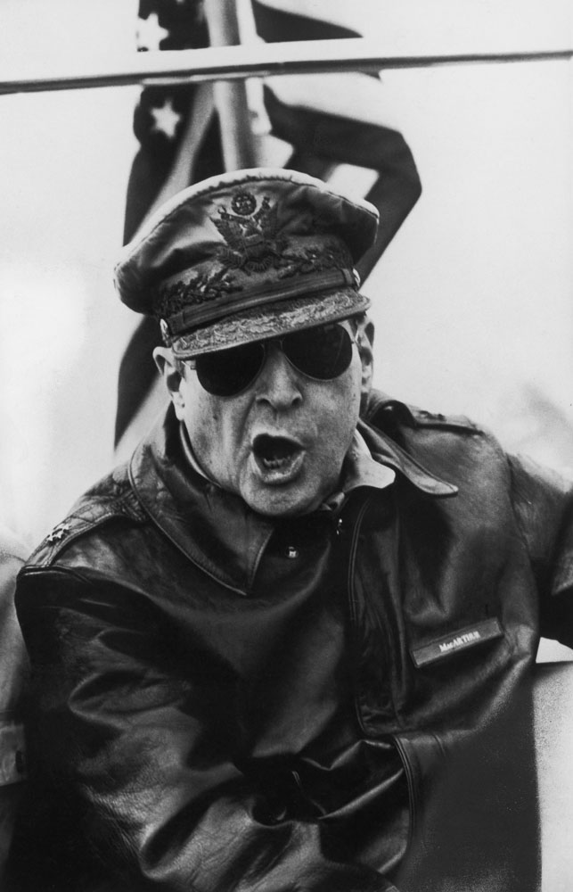 Gen. Douglas MacArthur roars orders from the bridge of the flagship USS Mount McKinley during an assault on the Inchon beachheads during the Korean War, 1950.