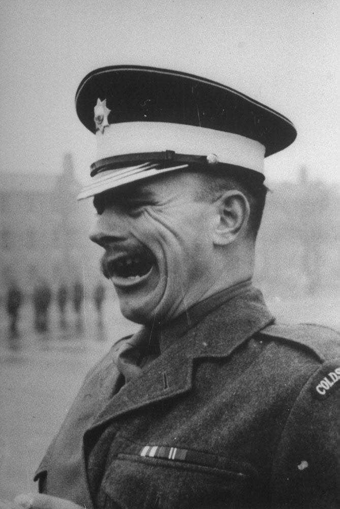 A tough sergeant bawls orders from the corner of his mouth, 1952.