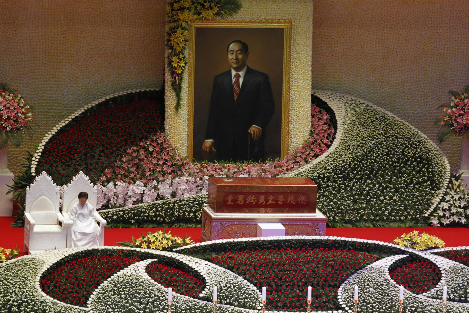 Sept. 15, 2012. Han Hak-ja, widow of Evangelist Reverend Sun-Myung Moon, sits beside the coffin of Moon during a funeral service in Gapyeong, South Korea.