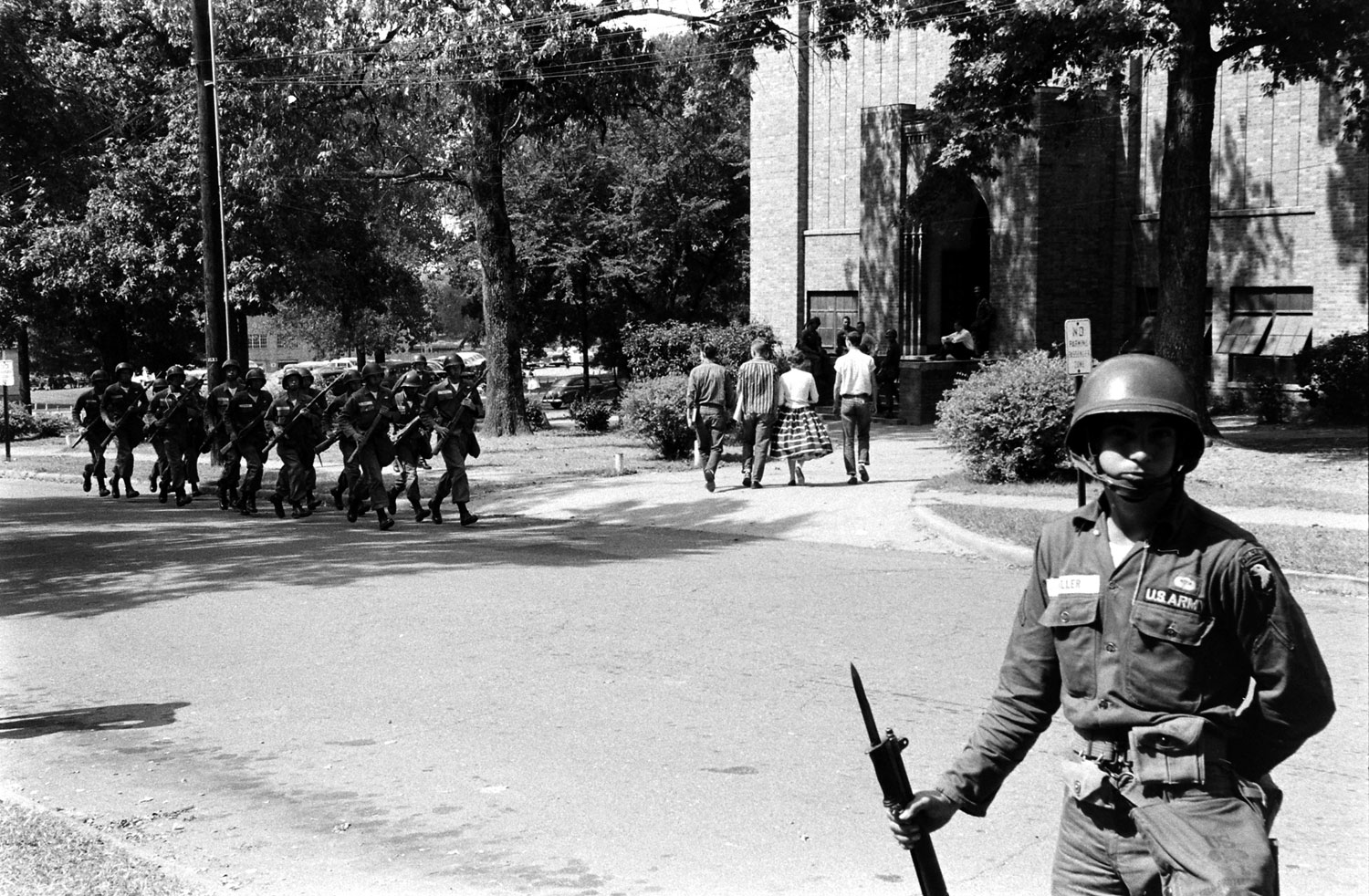 Troops from the 101st Airborne patrol the streets of Little Rock, Arkansas, 1957.
