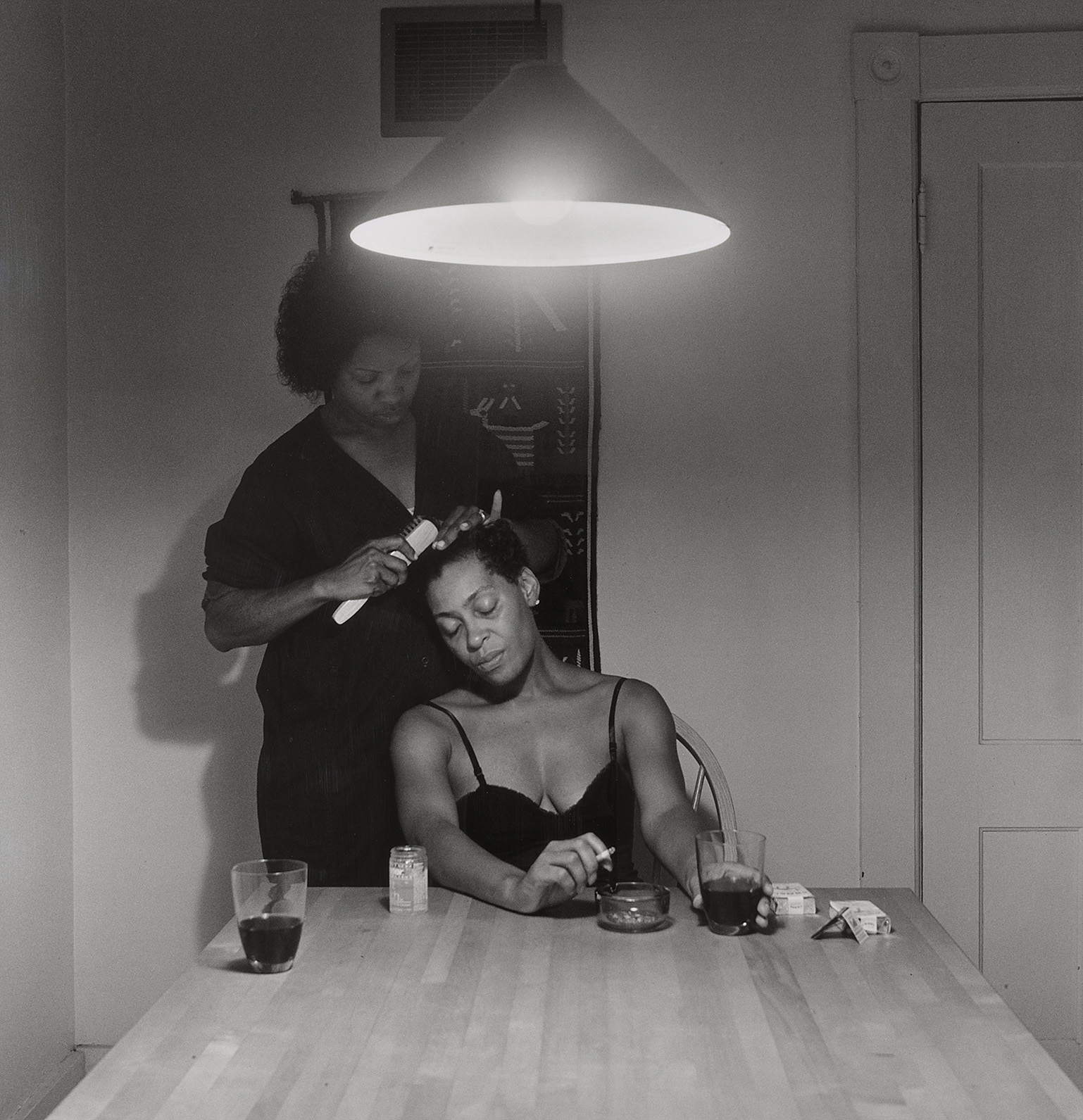 Untitled (Woman brushing hair)
                              from Kitchen Table Series, 1990.