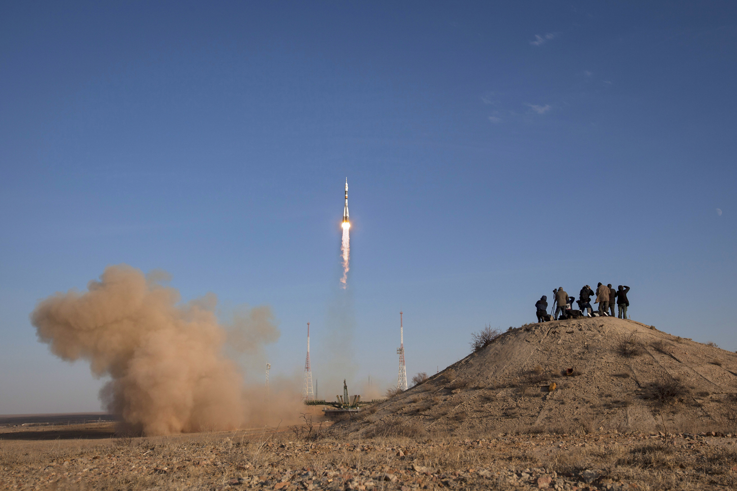 Image: Oct. 23, 2012. Members of the media photograph the Soyuz rocket as it launches in Baikonur, Kazakhstan.