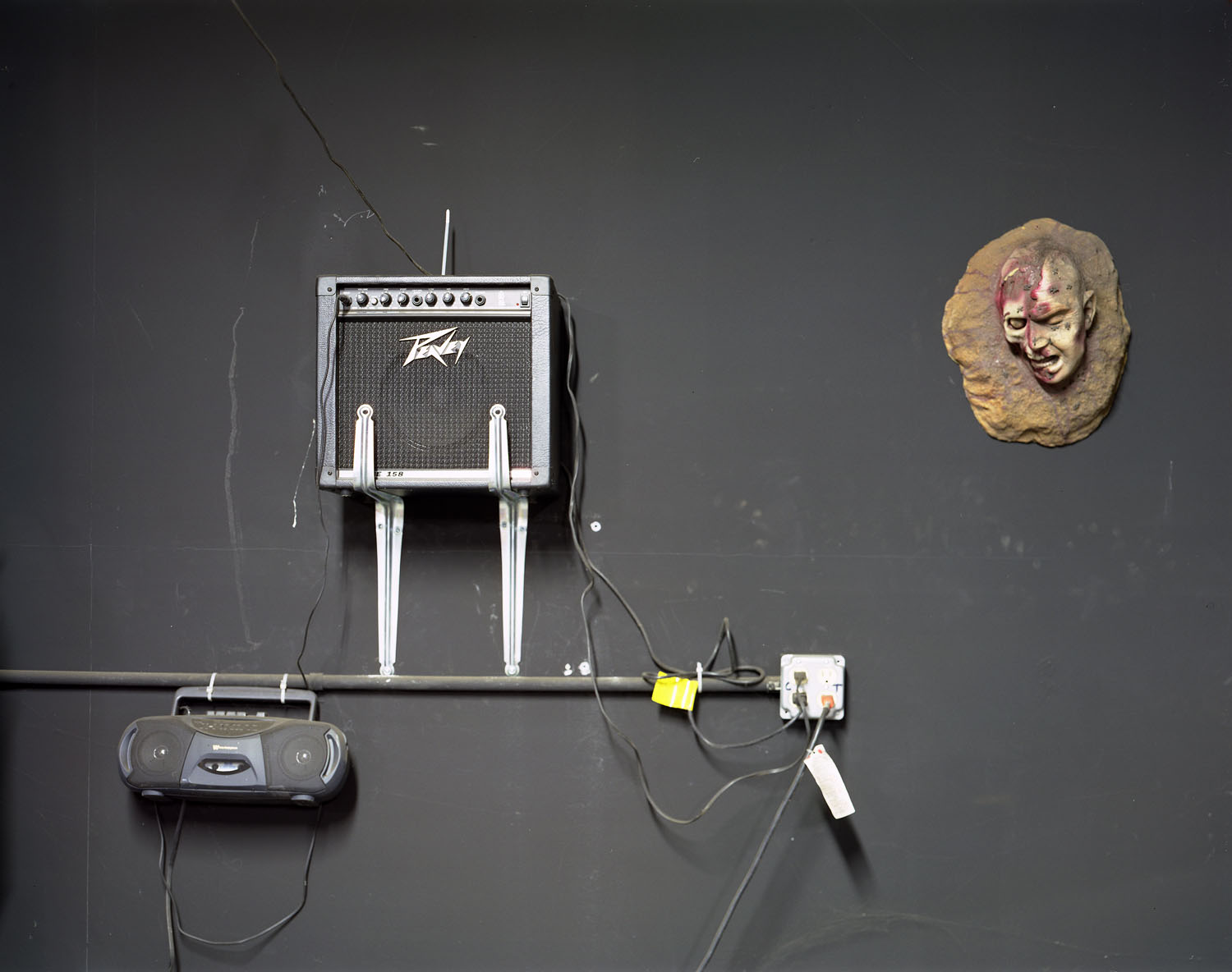 Image: Head with amp on wall