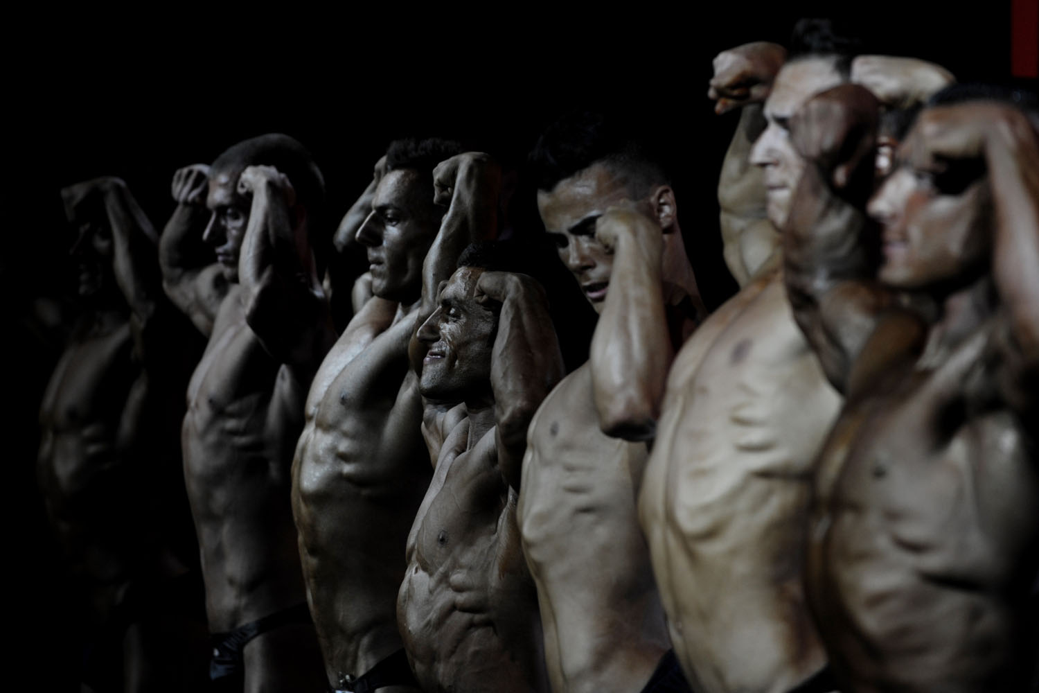 Oct. 6, 2012. Bodybuilders flex their muscles on stage during the Kosovo national bodybuilding championship in Pristina.