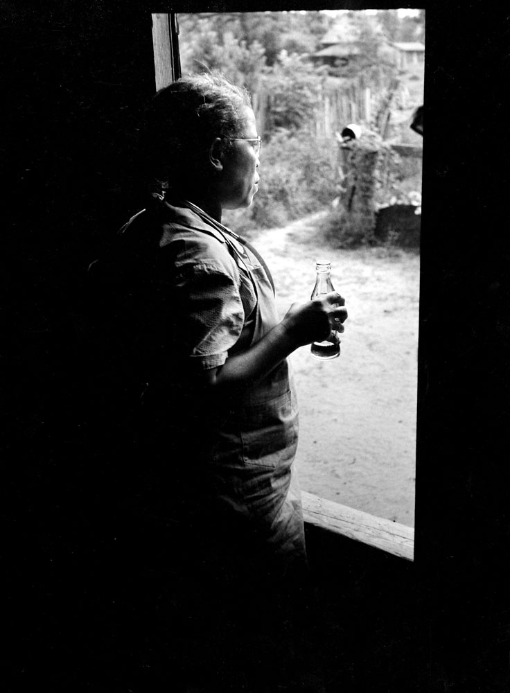Caption from LIFE. 6:20 A.M. Her work over at last, Nurse Midwife Callen quietly takes the first nourishment that she has had for more than 27 hours.