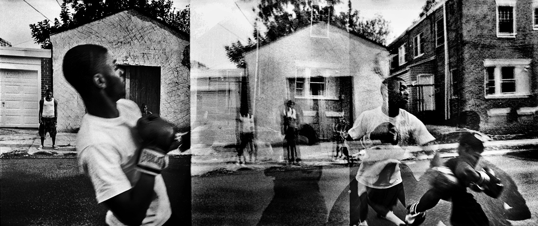 Justin Maxon was a 2012 finalist for the Eugene Smith Grant for his project When the Spirit Moves.
                              A boxing match is seen on the street between two friends. Boxing is a positive outlet for youth. The neighborhood is referred to as the “Madi Block” because Madison St. runs in the middle. It is one of the more violent areas of Chester. The group of young men depicted, lost their friend, Daniel  Pooh Bear  Simms, less then a year before, when he was shot in the back and killed running away from a Chester Police Officer.