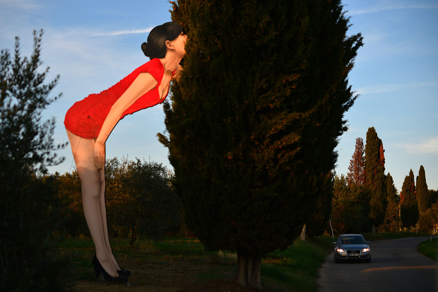 Oct. 5, 2012. A giant placard of a woman giving a kiss is set up by  a road near Gaiole in Chianti, Italy.