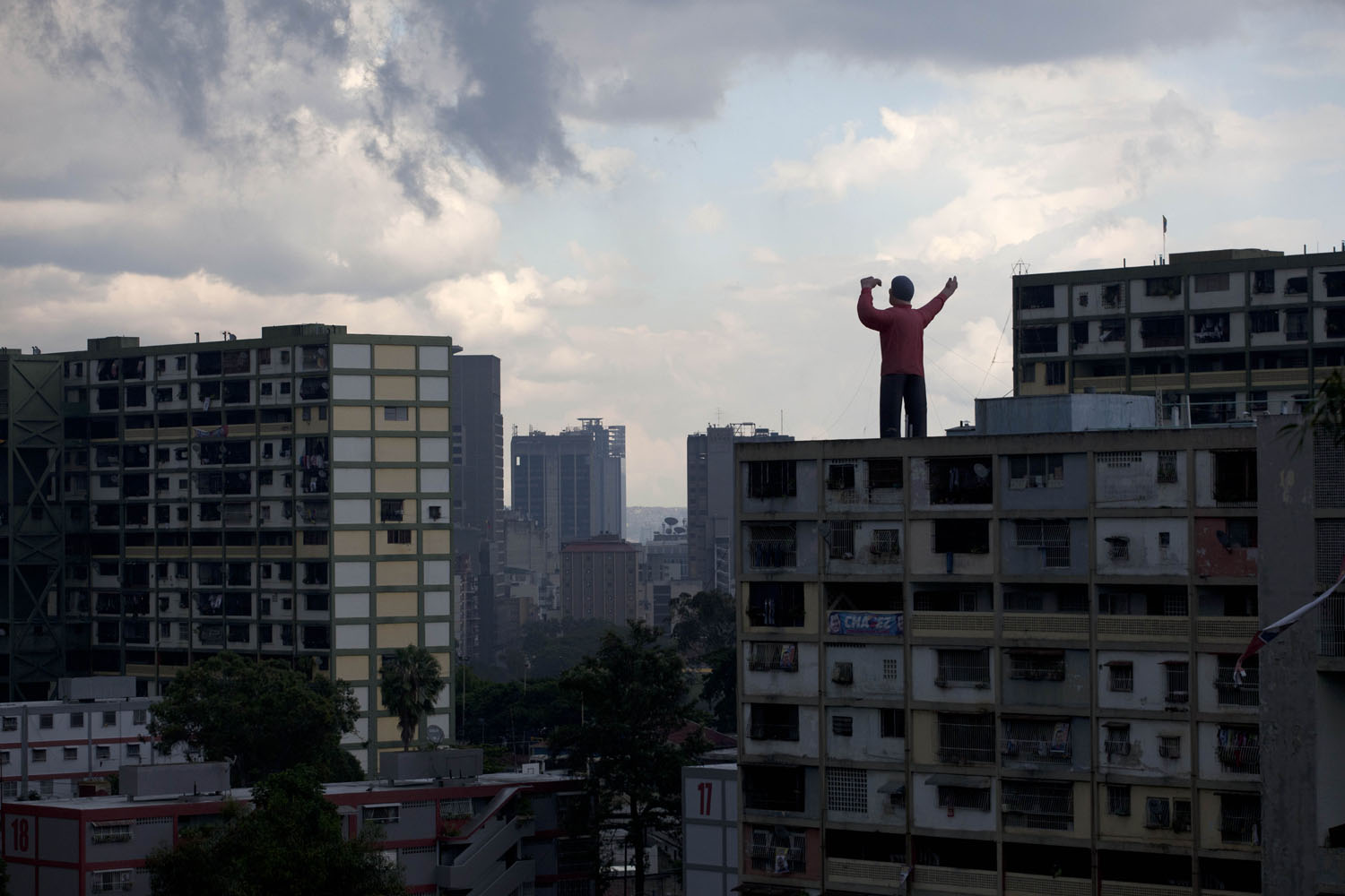 Oct. 6, 2012. A giant inflatable doll representing President Hugo Chavez stands on top of a building in Caracas.