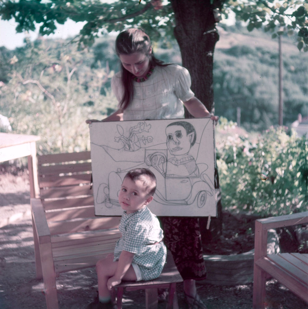 Françoise Gilot, Picasso's mistress, with their young son, Claude. She holds drawings of the boy by Picasso. Vallauris, France, 1949.