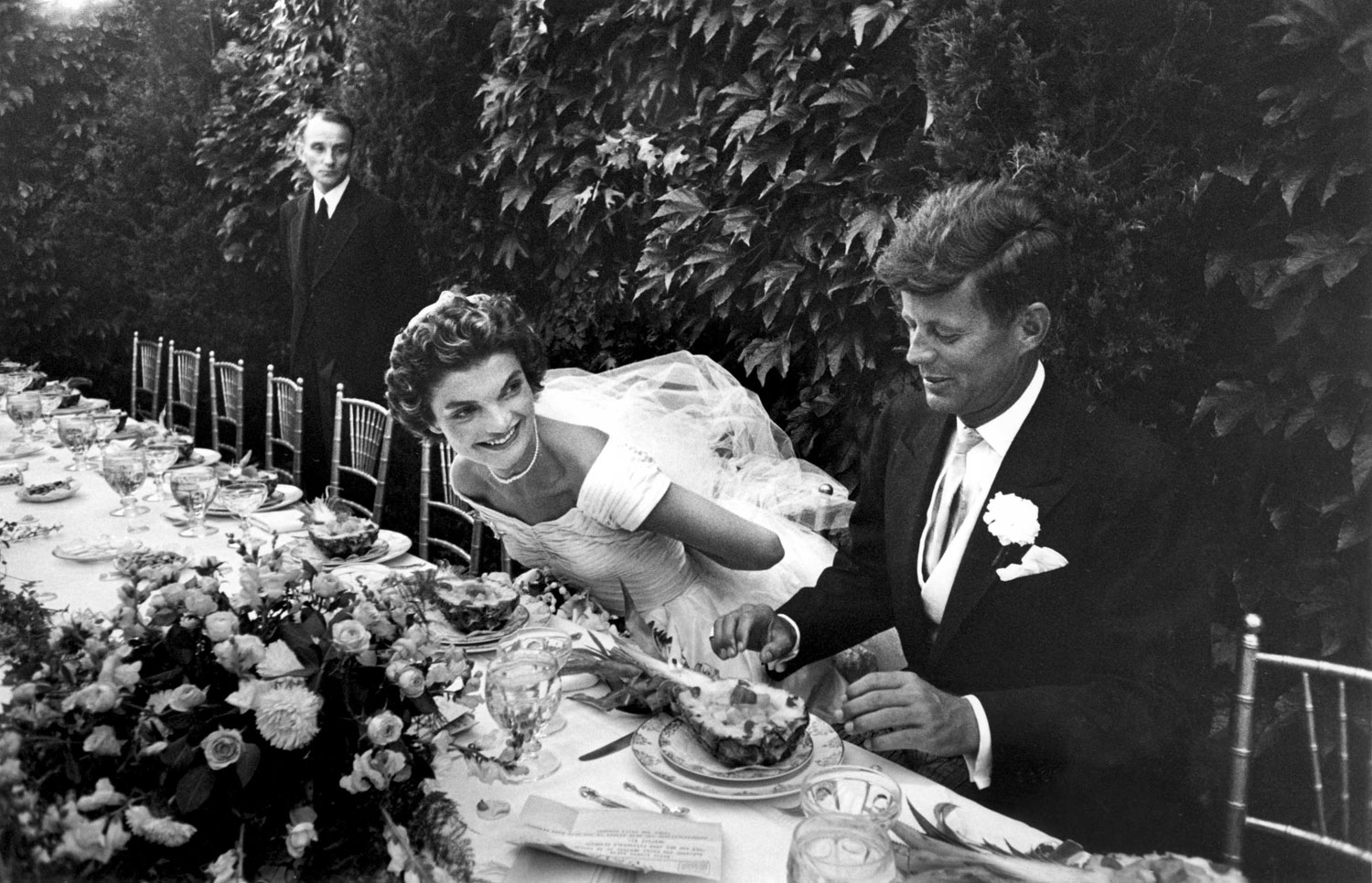 Future First Lady Jacqueline Bouvier Kennedy and Sen. John Kennedy at their wedding reception, 1953.