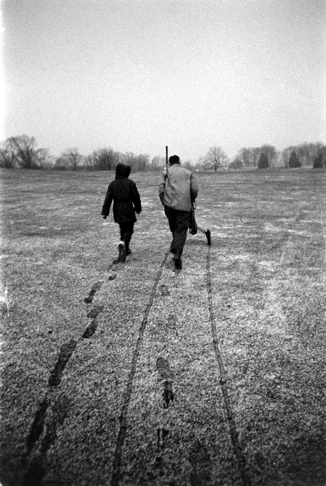 George Romney with his son, Mitt, on a frosty golf course, 1958.