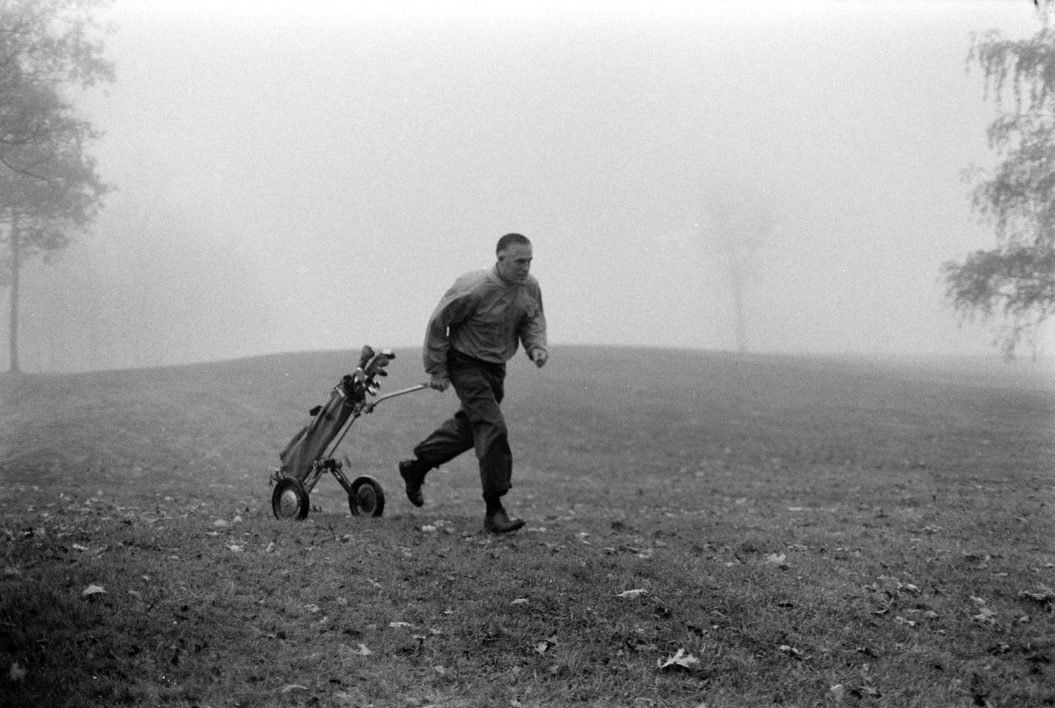 Michigan governor George Romney on the golf course, 1963.
