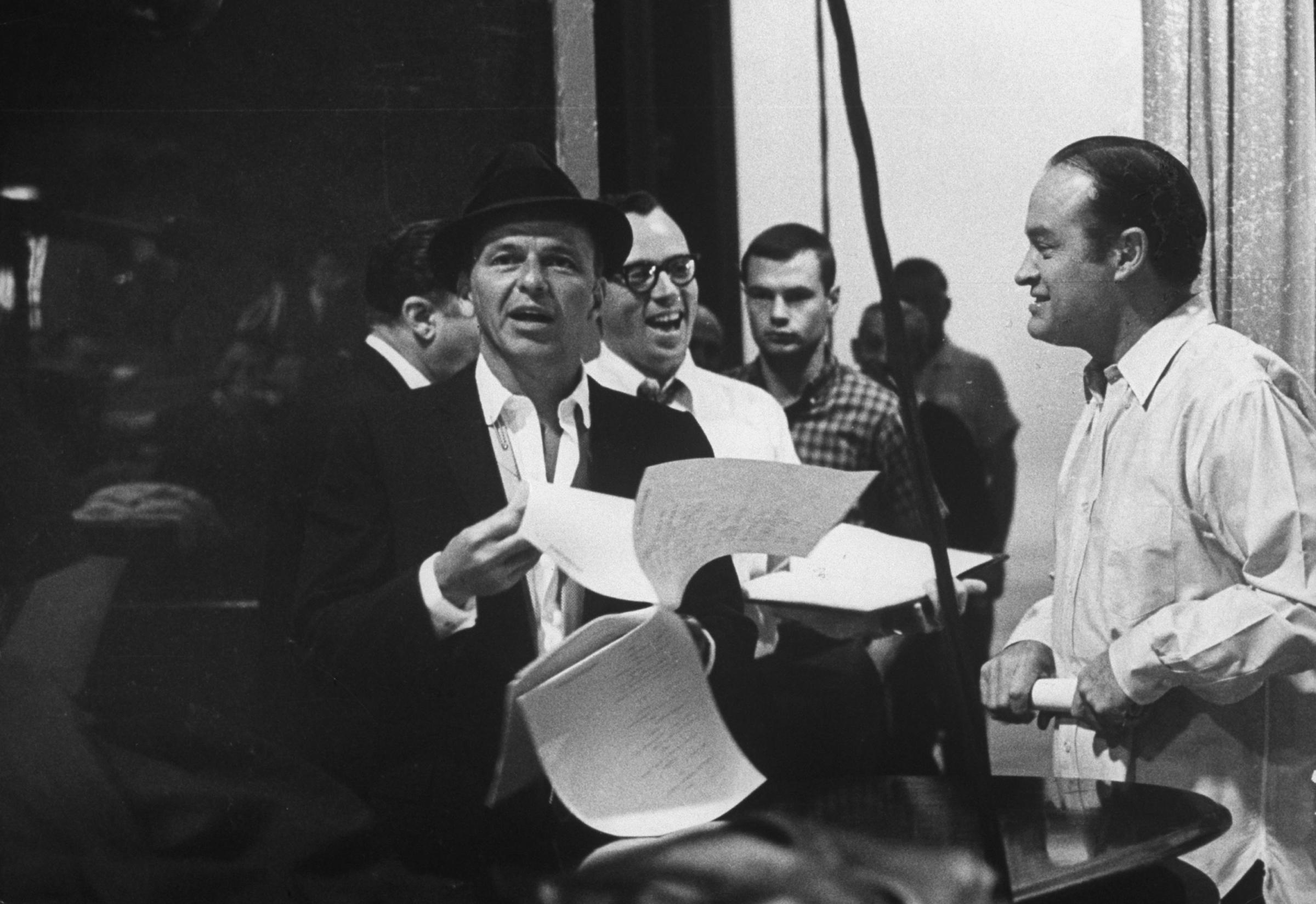 Bob Hope (right) and Frank Sinatra rehearse for The Bob Hope Show, 1962.