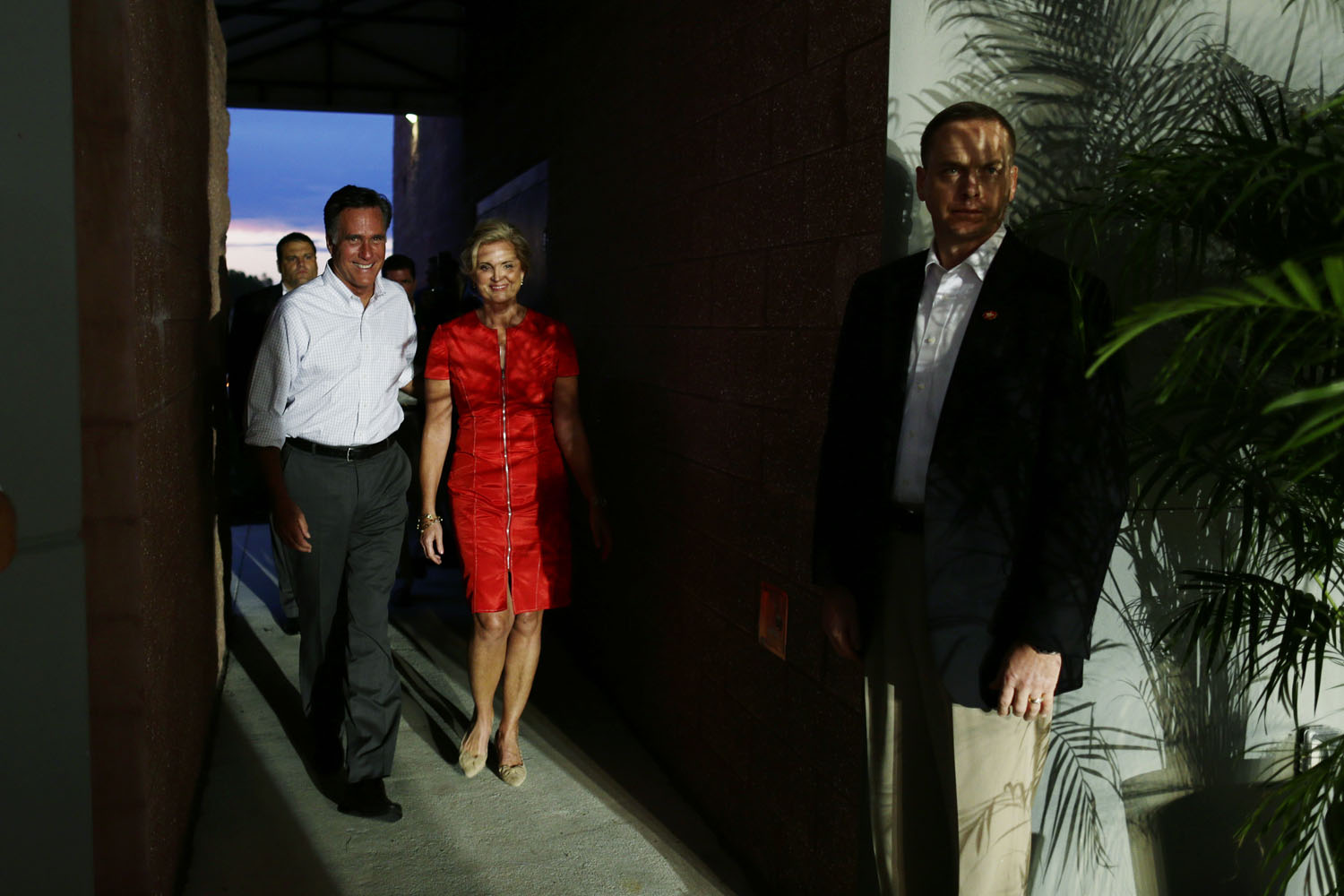 Oct. 6, 2012. Republican presidential candidate Mitt Romney and his wife Ann walk backstage before his campaign appearance in Apopka, Fla.