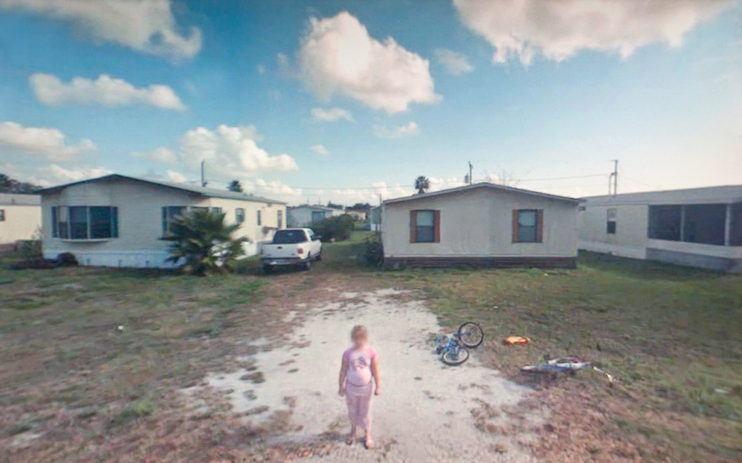 LightBox spoke with 12 artists who have been inspired by Google Maps in their work. Here, they describe how they have used this technology as part of their creative process. 
                              A New American Picture, by Doug Rickard
                              #27.144277, Okeechobee, FL. (2008), 2011
                              
                               The pictures that I chose don’t really have a strong feeling of spying; the pixilation and the broken elements actually emphasize the subtext and the emotion that I wanted to impart, which was America in a devastated form, almost the inverse of the American dream. The aesthetic that I used heightens that sense.