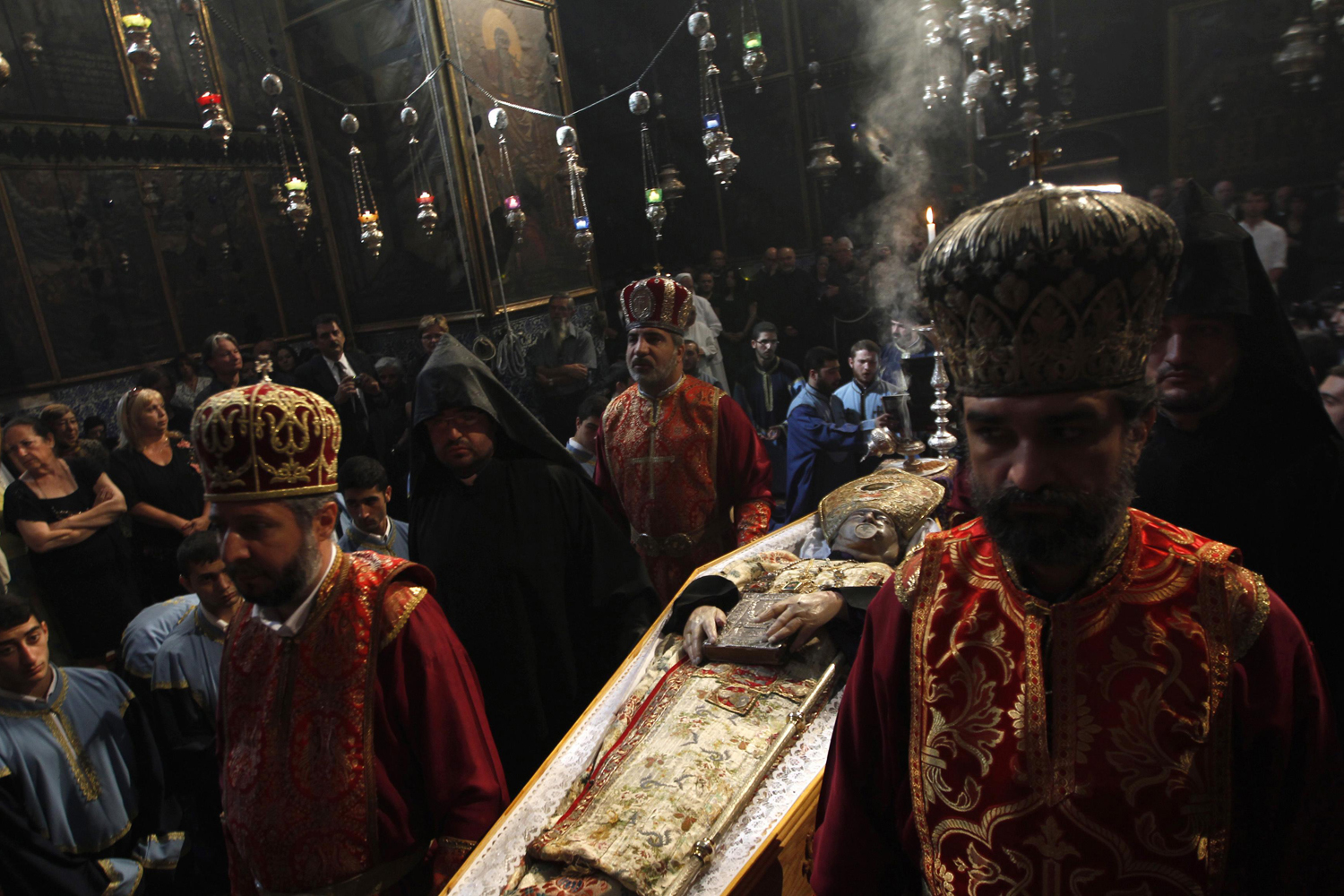 Image: Oct. 22, 2012. Priests carry the coffin of Armenian Patriarch of Jerusalem Archbishop Torkom Manoogian during his funeral at the Armenian Church in Jerusalem.