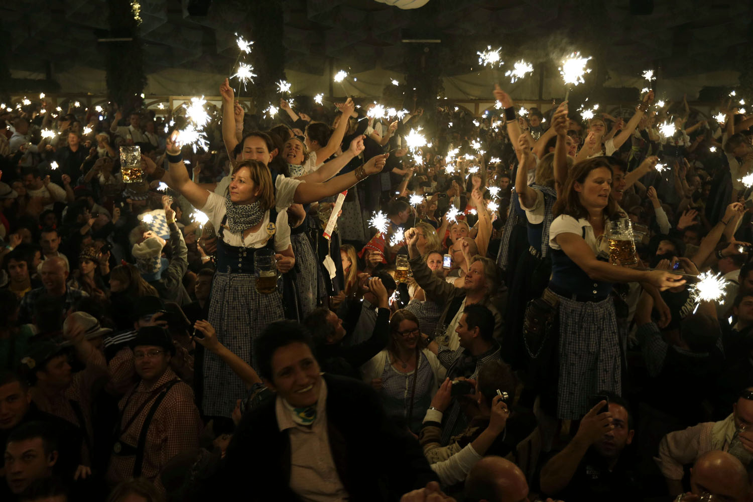 Oct. 7, 2012. Waitresses dance on tables in a beer tent on the final evening of the famous Bavarian  Oktoberfest  beer festival in Munich, southern Germany.