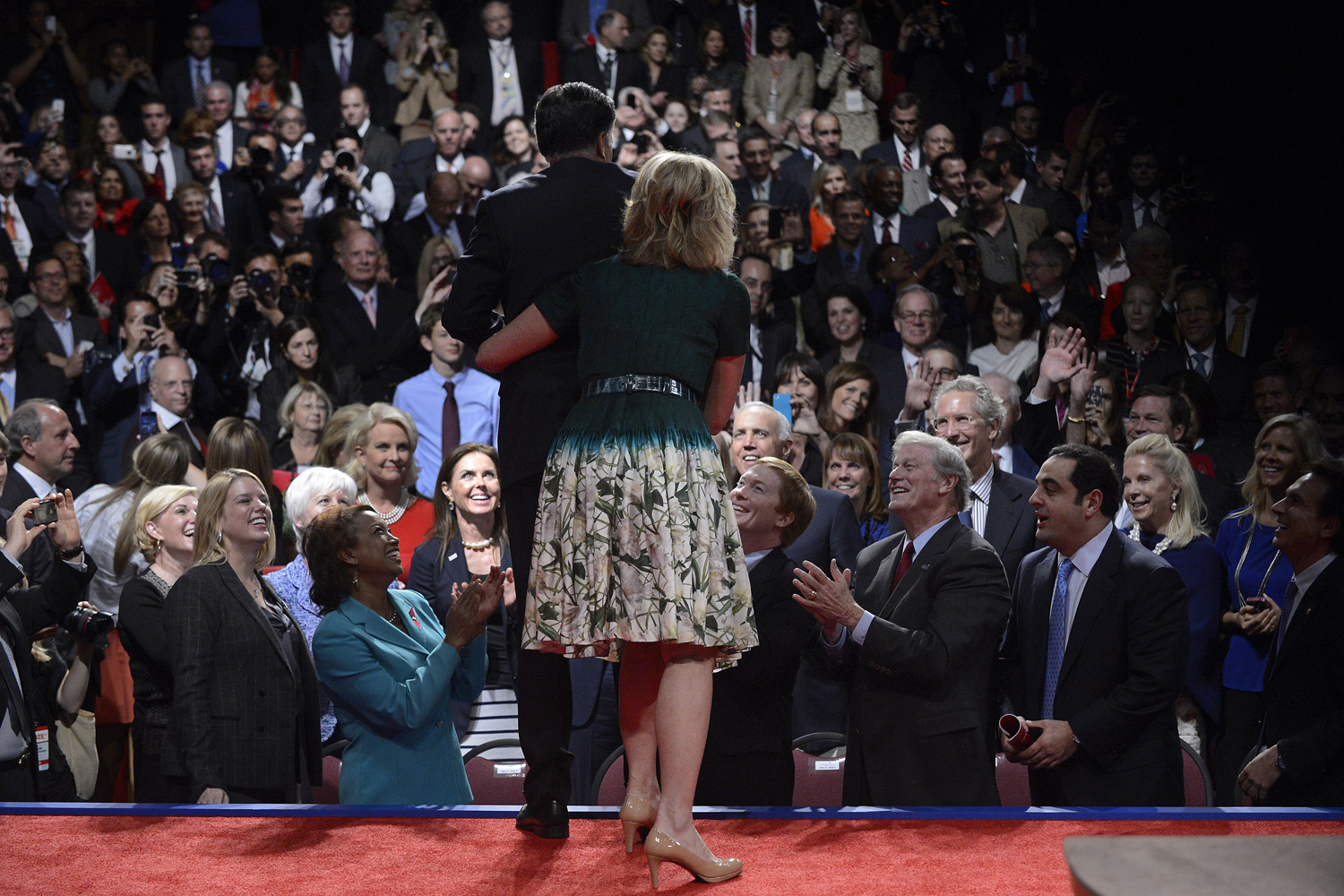 Image: Oct. 22, 2012. Republican Presidential Candidate Mitt Romney is embraced by his wife Ann as members of the audience applaud after the conclusion of the final Presidential debate with President Barack Obama on the campus of Lynn University in Boca Raton, Florida.