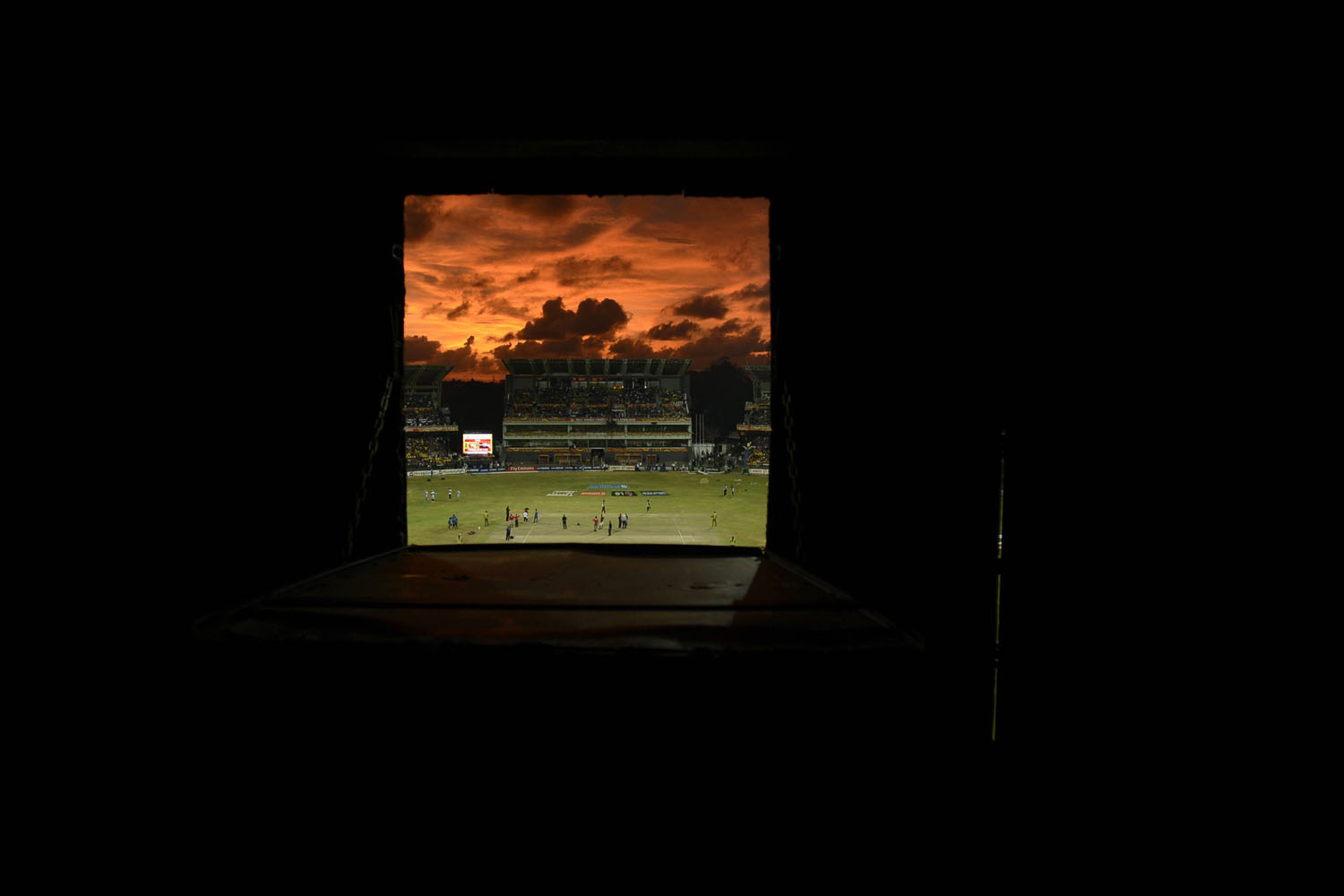 Oct. 7, 2012. A view of the R Premadasa stadium at sunset through a hole in the scoreboard before the world Twenty20 final between Sri Lanka and the West Indies at R Premadasa Stadium, Colombo, Sri Lanka.