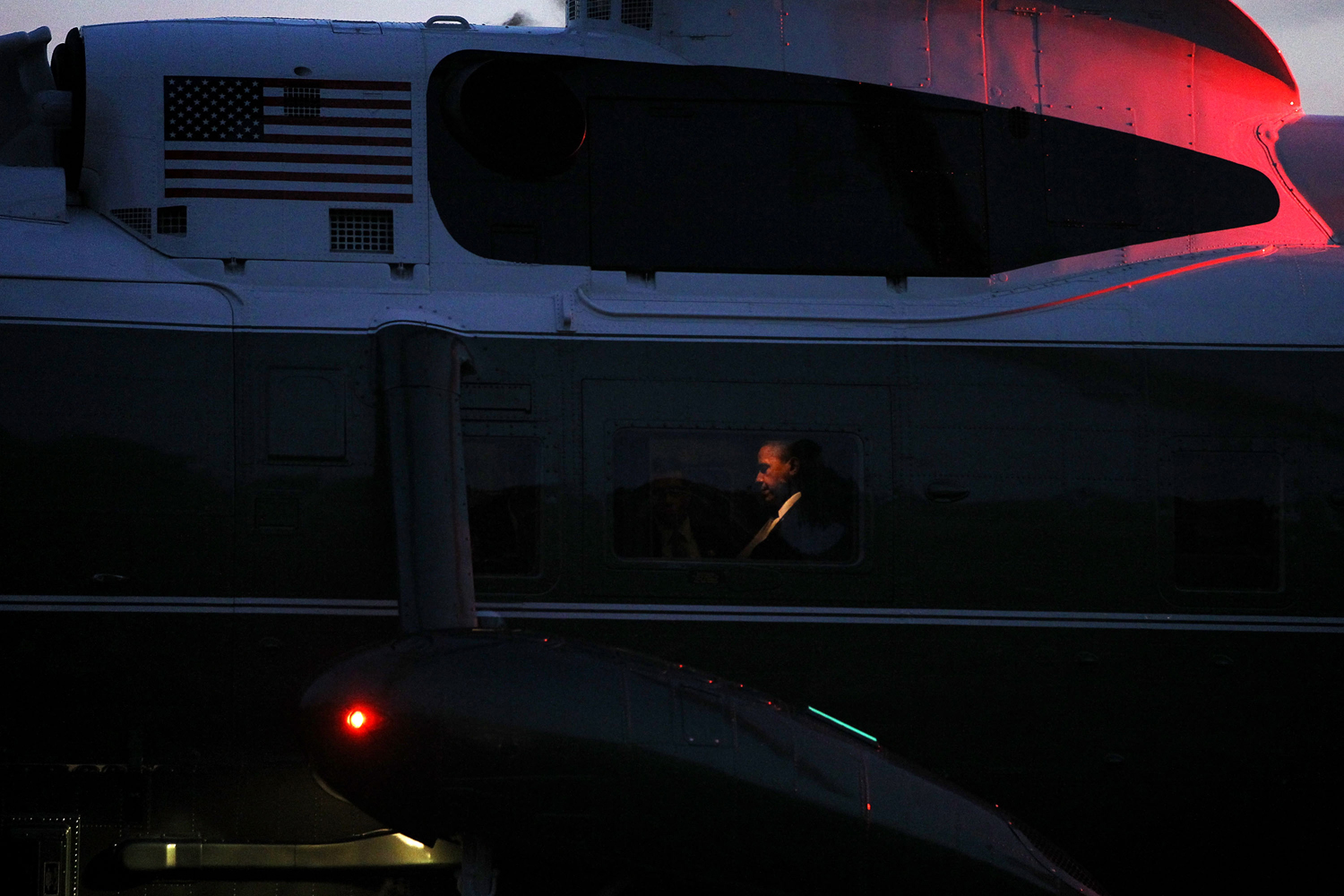 Image: Oct. 23, 2012. U.S. President Barack Obama sits aboard Marine One as it lands on the South Lawn of the White House in Washington, D.C.