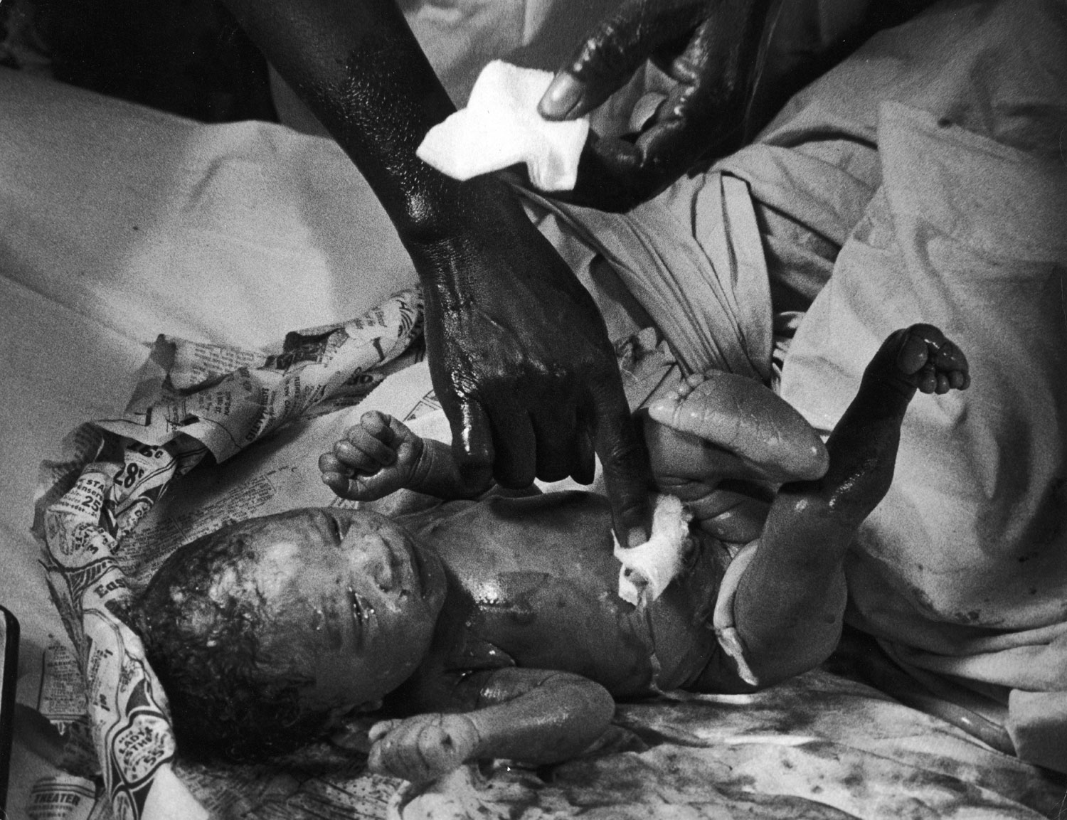 Not published in LIFE. Newborn delivered by nurse midwife Maude Callen, South Carolina, 1951.