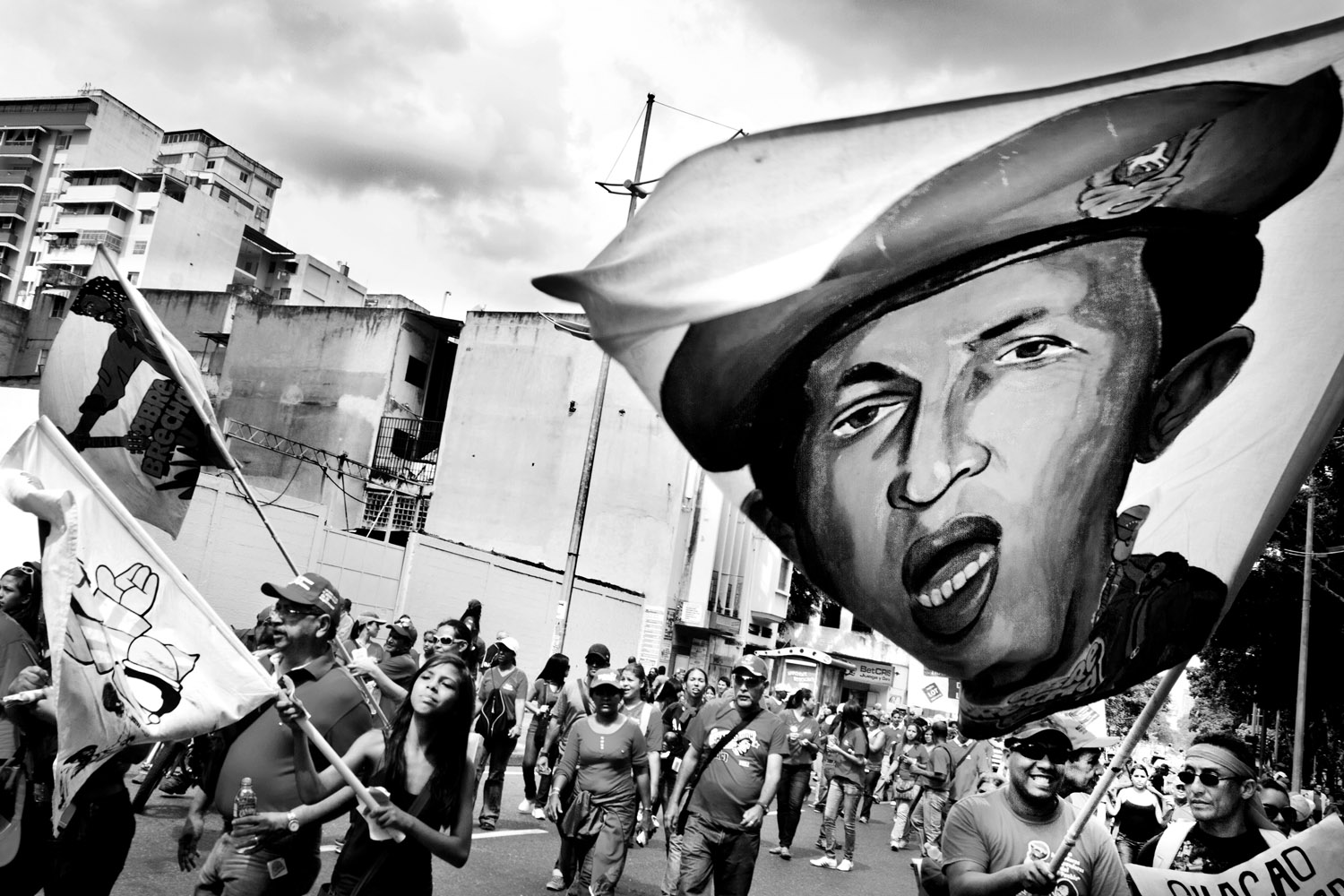 Abrebrecha  Collective members rally on May 1, together with hundreds of thousands of partisans, to show their support for President Hugo Chavez and the recently approved Organic Work Law, which they see as a step toward workers' rights and justice.