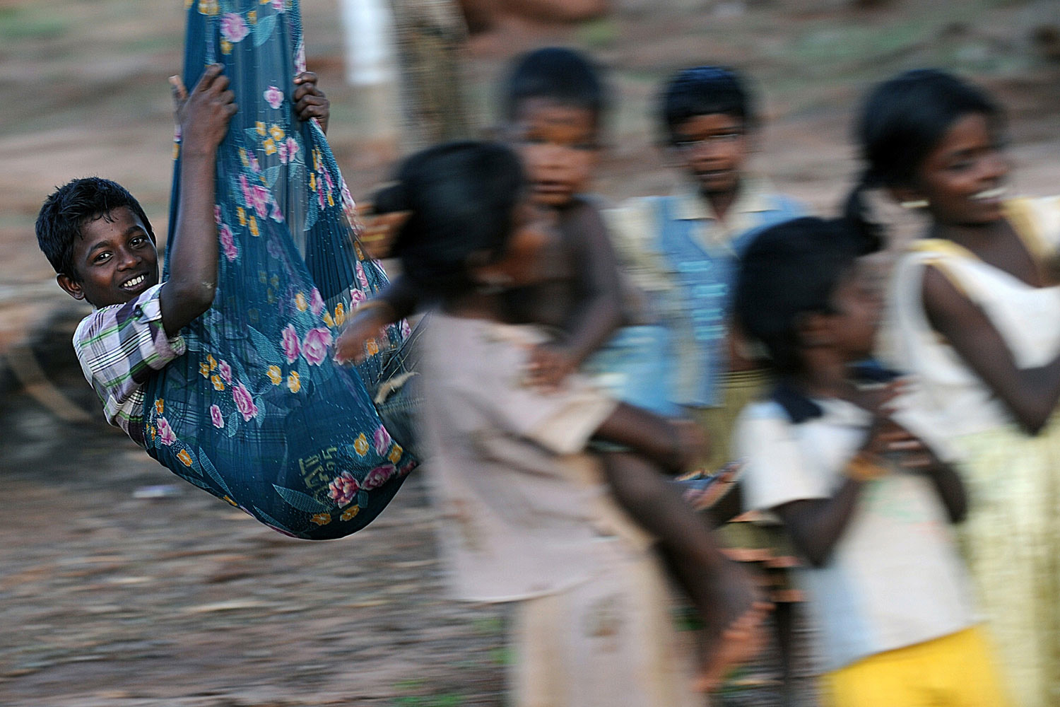 Image: Oct. 21, 2012. Sri Lankan Tamil children play on a swing in a village in the former war zone district of Mullaittivu. The United States and the UN have expressed concern over "rushed re-settlement" of thousands of Tamil civilians displaced by Sri Lanka's separatist war that ended three years ago.
