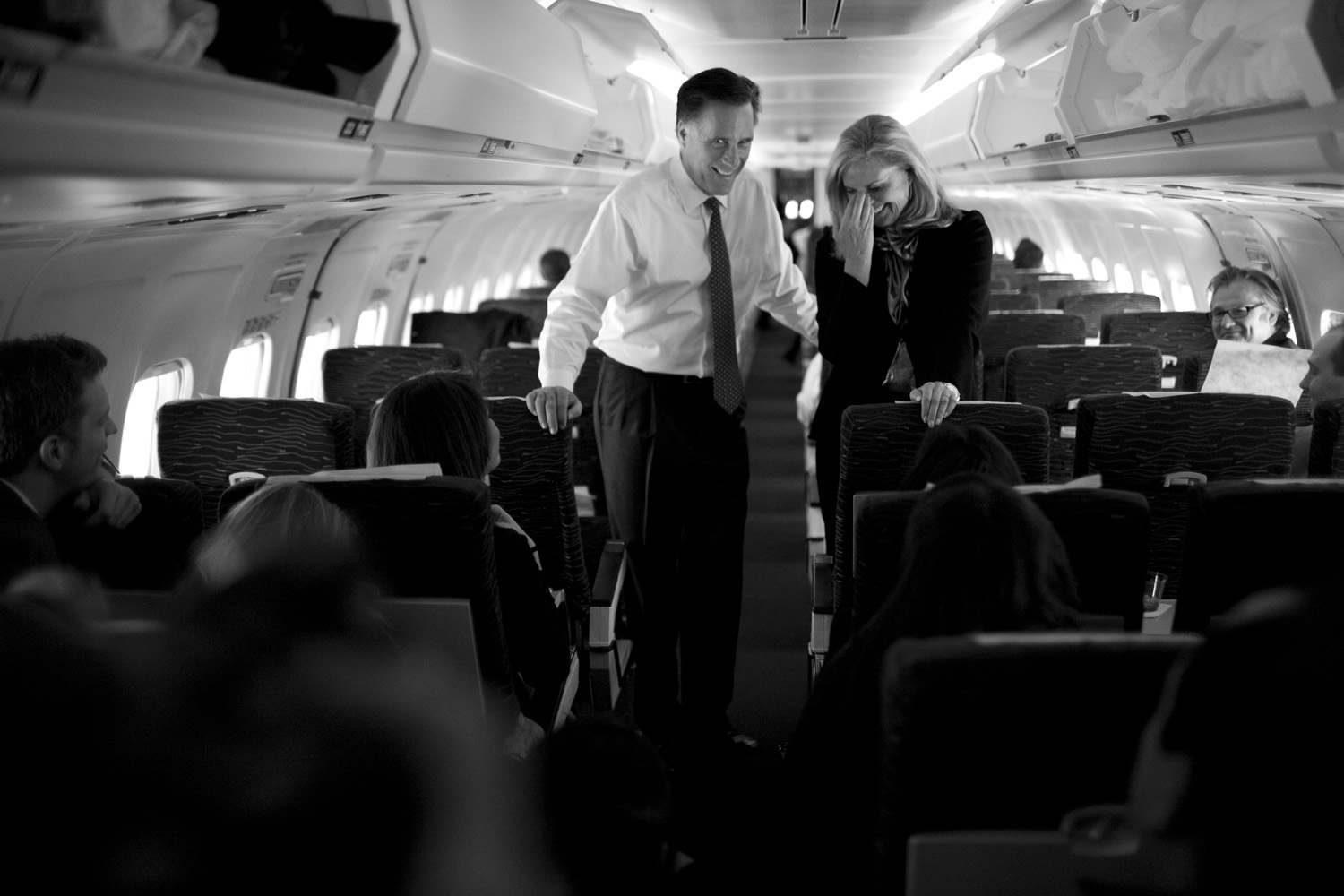 Image: Mitt Romney and his wife Ann talk to reporters on his campaign plane in Columbus, Ohio, before taking off for Boston. March 6, 2012.