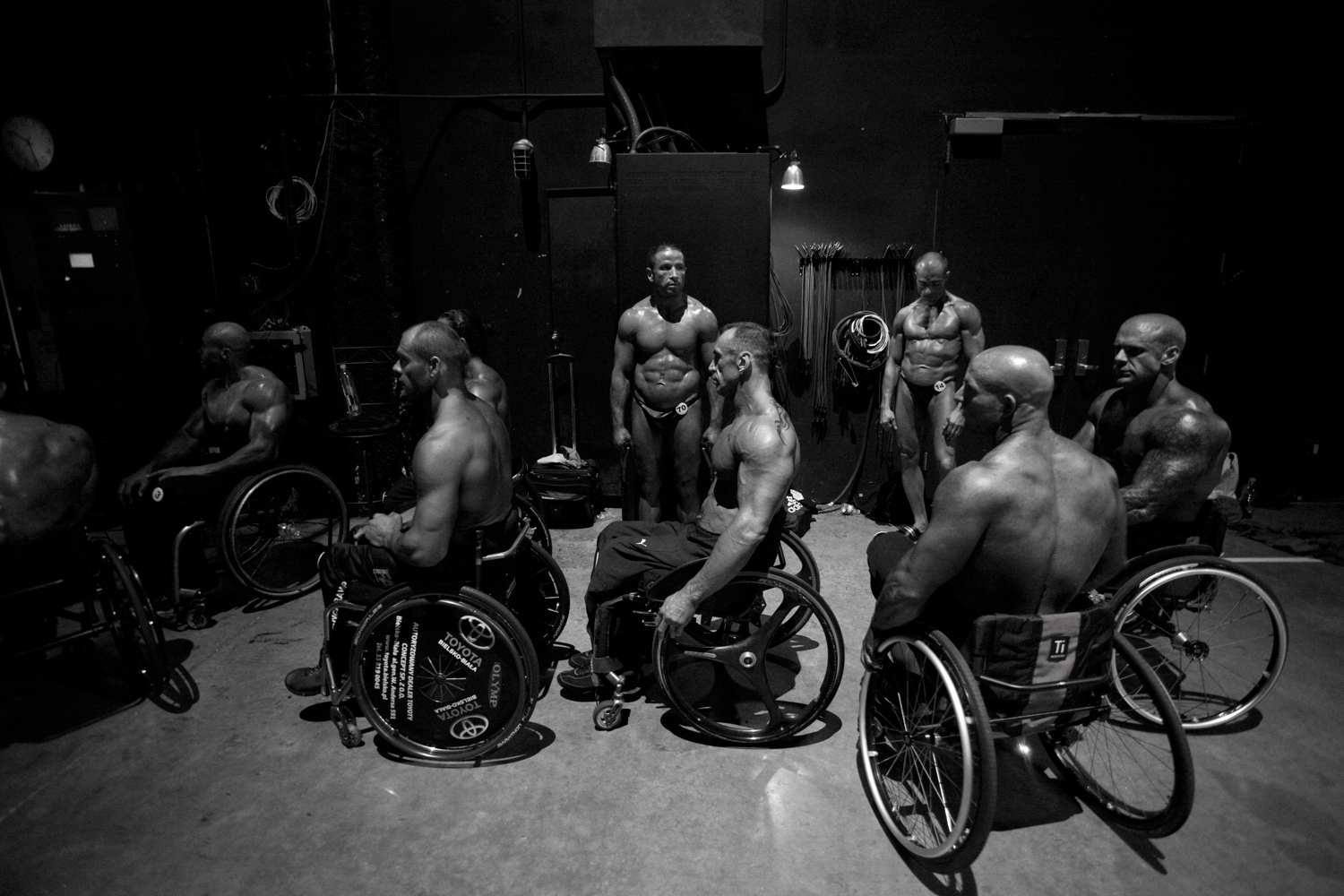 Wheelchair athletes wait their turn to take the stage at the wheelchair bodybuilding pro show in Houston.