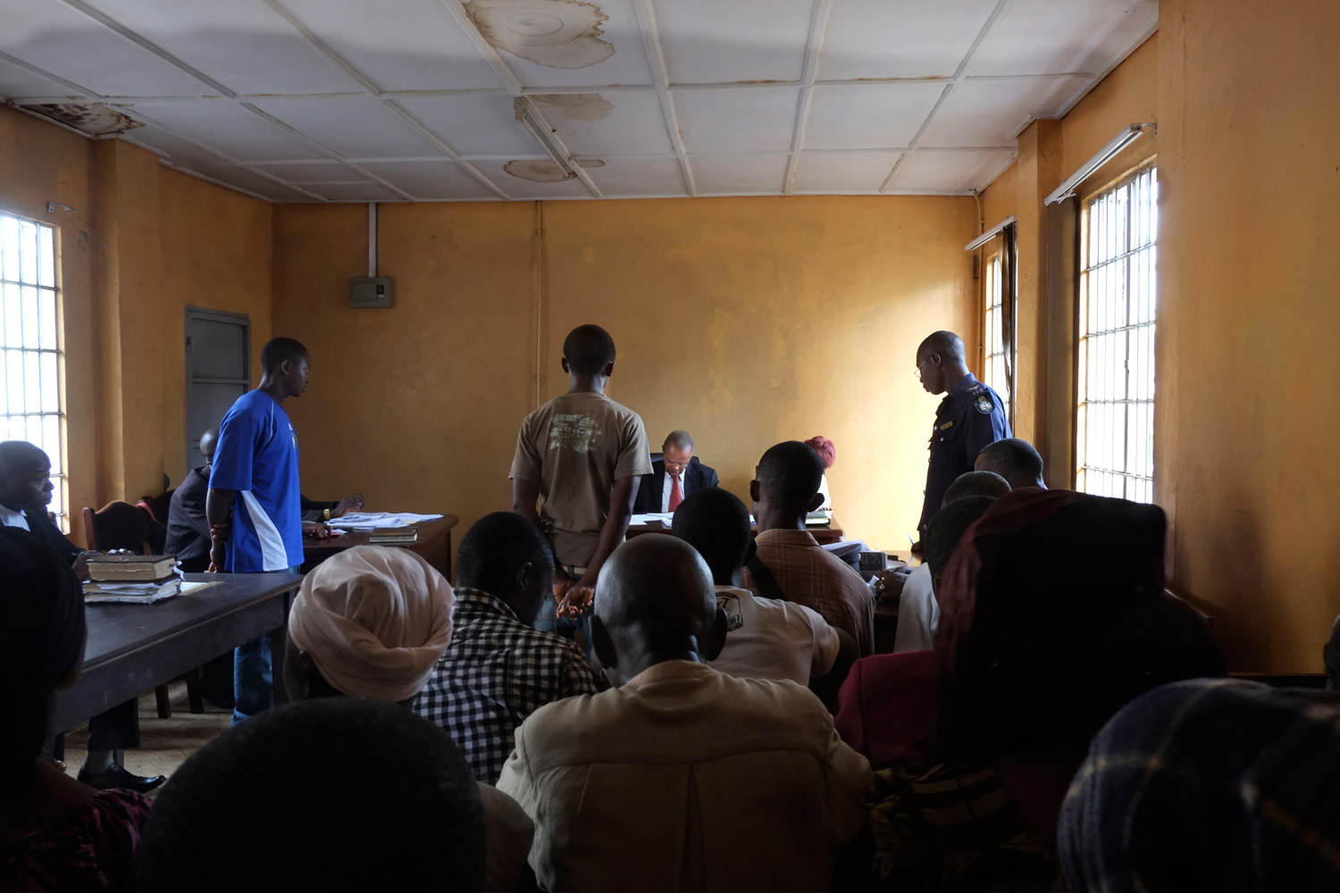 The rest of photographs in this gallery were made in October 2012.
                              Two years after he was first photographed, and after serving his time and being released, Sesay was again accused of stealing — this time a mobile phone. Here, Sesay appears before the judge in the juvenile court in Freetown. Photographer Fernando Moleres reimbursed the owner of the phone, and as a result Sesay was released. Moleres then took Sesay to the Saint Michael rehabilitation center, where he now lives.