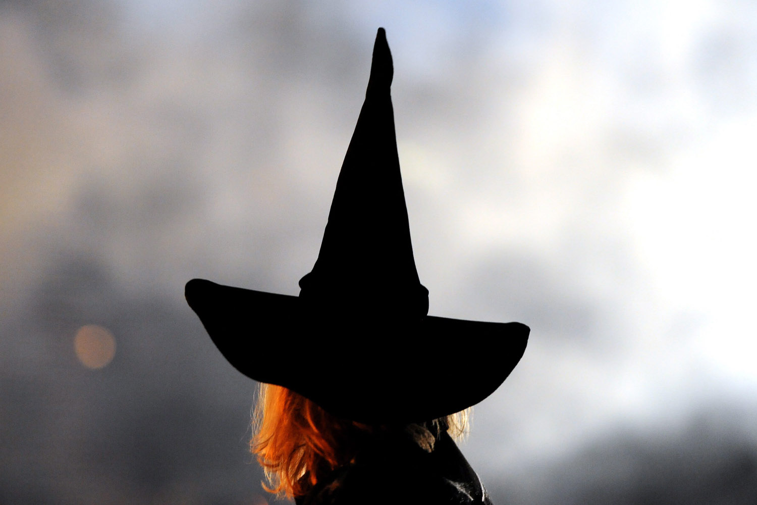 Image: Oct. 31, 2012. A woman wears a witch's hat at a Halloween party at the Tierpark zoo in Berlin.